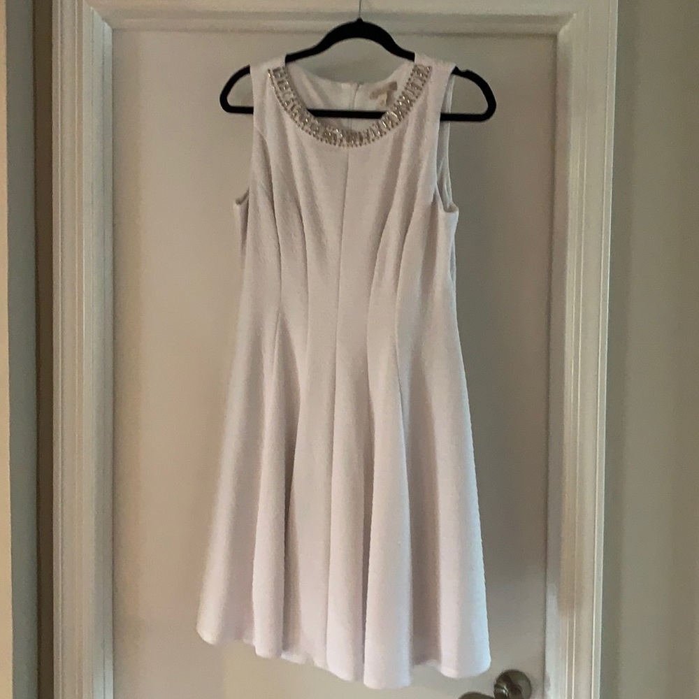 White dress: crepe textured, jeweled neck